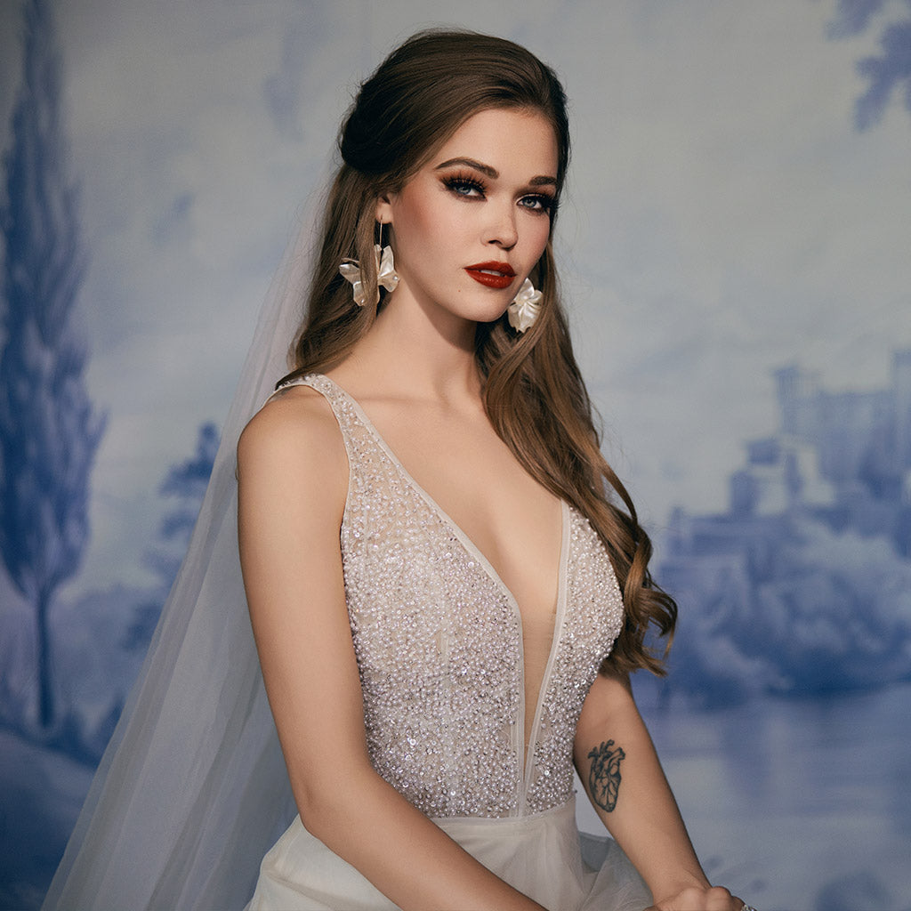 Bridal Photography Backdrops & Wedding Photography Backdrops - Bride in a beaded dress with a blurred scenic background