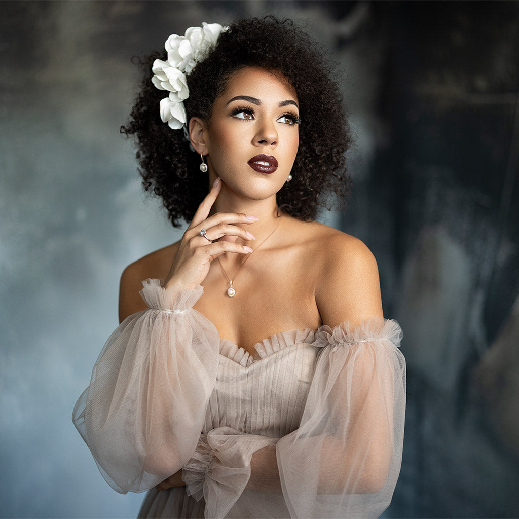 Portrait Photography Backdrops by Intuition - Woman in a elegant dress with a blurred background. Featuring the Criollo Room Backdrop.